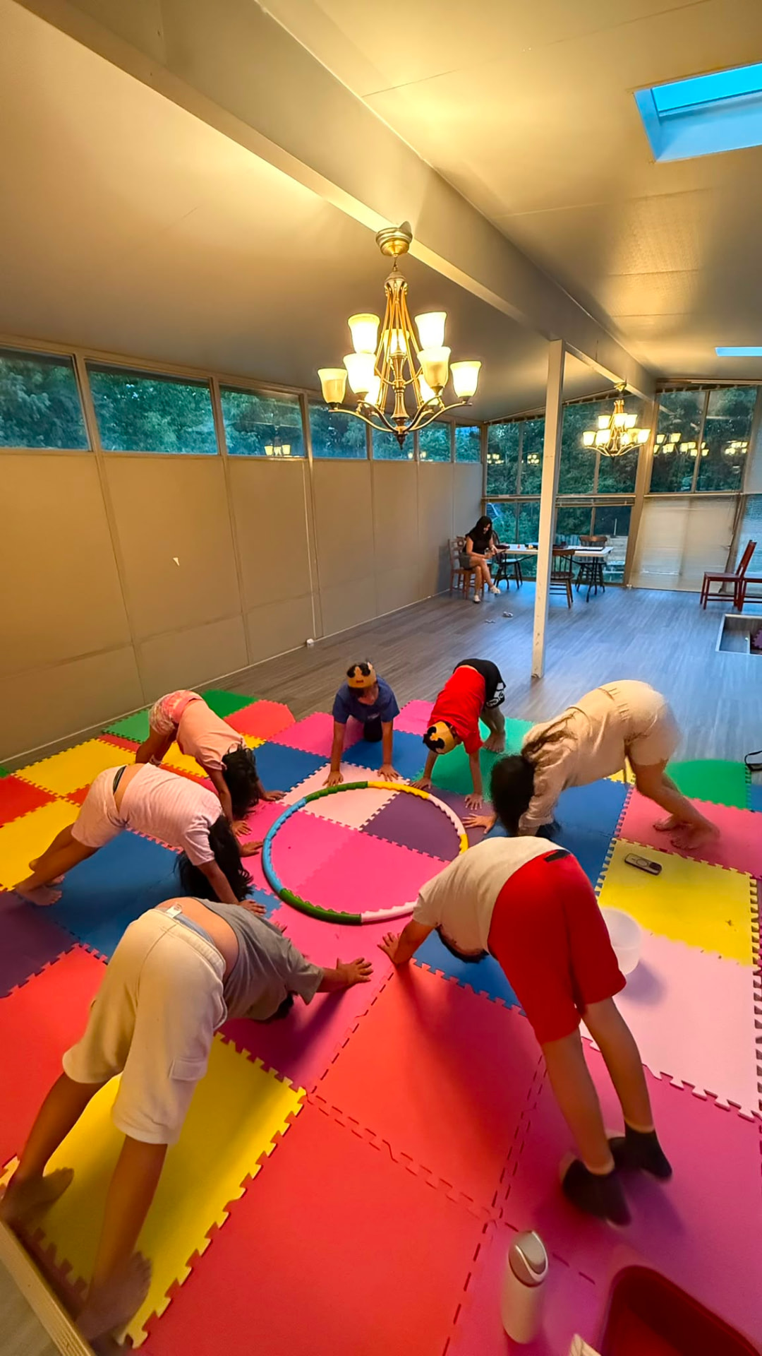 Children in a movement circle on play mats